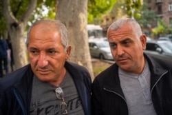 Grigor, left, and Arsan are bus driver who worry the current conflict is growing more dangerous than ever in about 30 years of war for Nagorno-Karabakh, in Yerevan, Armenia on Oct. 6, 2020. (Yan Boechat/VOA)