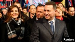 Leader of Macedonian ruling party VMRO-DPMNE and former Prime Minister Nikola Gruevski and his wife, Borkica, greet supporters during an election campaign rally in Ohrid, Macedonia, Nov. 21, 2016.