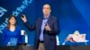 Intel CEO Brian Krzanich talks about a wearable tracker that uses geofencing technology during a keynote address the International Consumer Electronics Show, Jan. 6, 2014, in Las Vegas.