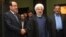 FILE - Iran's President Hassan Rouhani (c) shakes hands with Iraqi Prime Minister Nouri al-Maliki, in their meeting in Tehran, Iran.