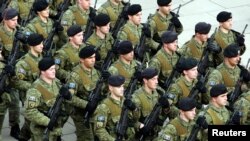 FILE - Kosovo security forces take part in a parade during celebration of the 10th anniversary of Kosovo's independence, in Pristina, Kosovo, Feb. 18, 2018.