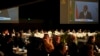 Delegates watch South Africa's President Cyril Ramaphosa addressing them at the G20 finance ministers meeting in Cape Town, South Africa, Feb. 26, 2025. 