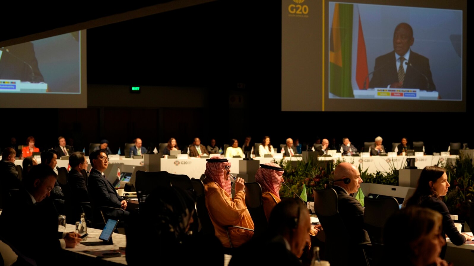 Delegates watch South Africa's President Cyril Ramaphosa addressing them at the G20 finance ministers meeting in Cape Town, South Africa, Feb. 26, 2025. 