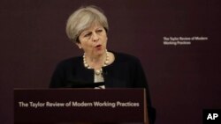 British Prime Minister Theresa May delivers a speech on modern working practices at the Royal Society for the encouragement of Arts, Manufactures and Commerce in London, July 11, 2017.