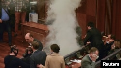 Tear gas is released during a session of parliament in Pristina, Kosovo, ahead of a vote on the selection of Hashim Thaci as president, Feb. 26, 2016. 