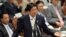 Japanese Prime Minister Shinzo Abe answers a question by an opposition lawmaker at the Upper House at the National Diet in Tokyo, April 23, 2013.