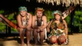 Juma Indigenous sisters Mandei Juma, from left, Mayta Juma and Borea Juma pose for a picture at their community, near Canutama, Amazonas state, Brazil, July 9, 2023. 