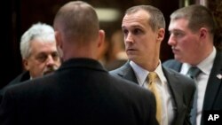 Corey Lewandowski (center) former campaign manager for President-elect Donald Trump, walks in the lobby of Trump Tower in New York, Dec. 7, 2016. 