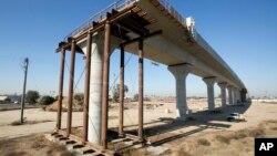FILE - One of the elevated sections of the high-speed rail under construction in Fresno, Calif.