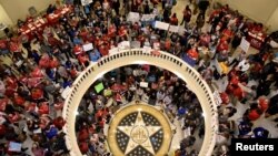 Teachers pack the state Capitol rotunda to capacity, on the second day of a teacher walkout, to demand higher pay and more funding for education, in Oklahoma City, Oklahoma, April 3, 2018.
