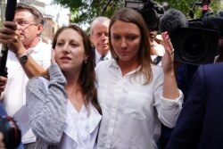 Michelle Licata and Courtney Wild, alleged victims of financier Jeffrey Epstein leave after the Southern District of New York announced charges of sex trafficking and conspiracy, July 8, 2019.