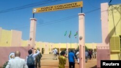 FILE - People enter the G5 Sahel force’s new military headquarters in Sevare, in central Mali, Oct. 22, 2017.