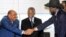 Sudan's President Omar Hassan al-Bashir (L) shakes hands with South Sudan's President Salva Kiir as African Union mediator and former South African leader Thabo Mbeki looks on during a meeting on the situation between Sudan and South Sudan, in the Ethiopi