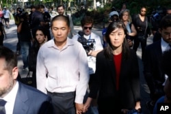 Linda Sun, a former aide to New York Governor Kathy Hochul, and her husband, Christopher Hu, leave Brooklyn Federal Court after their arraignment, Sept. 3, 2024, in New York.