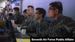 FILE - A US Army sergeant works on battle plans alongside Republic of Korea air force officers, March 10, 2015, during an exercise at South Korea's Osan Air Base. (US Air Force photo)