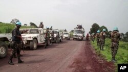 FILE — In this image from video, United Nations peacekeepers guard the area where a U.N. convoy was attacked and the Italian ambassador to the Democratic Republic of Congo was killed, in Nyiragongo, North Kivu province, on February 22, 2021. 