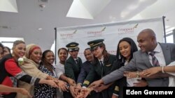 An all-female flight crew from Ethiopian Airlines celebrates at Washington Dulles International Airport after arriving from Addis Ababa, March 8, 2020 (Eden Geremew/VOA)