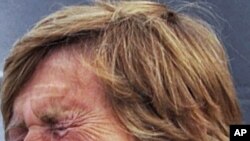 Diana Nyad cries as she speaks to reporters and fans after arriving back in Key West, Florida August 9, 2011