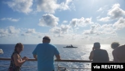 The Thai navy stealth frigate HTMS Bhumibol Adulyadej is seen from the MS Westerdam cruise ship in waters just off the Thai coast, Feb.12, 2020. 