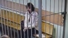 A U.S. citizen, whom the statement named as Kalob Wayne Byers, sits in a cage during a court session in Moscow, Russia, Oct. 7, 2024, in this photo taken from video released by the Moscow City Court Press Service on Feb. 15, 2025.