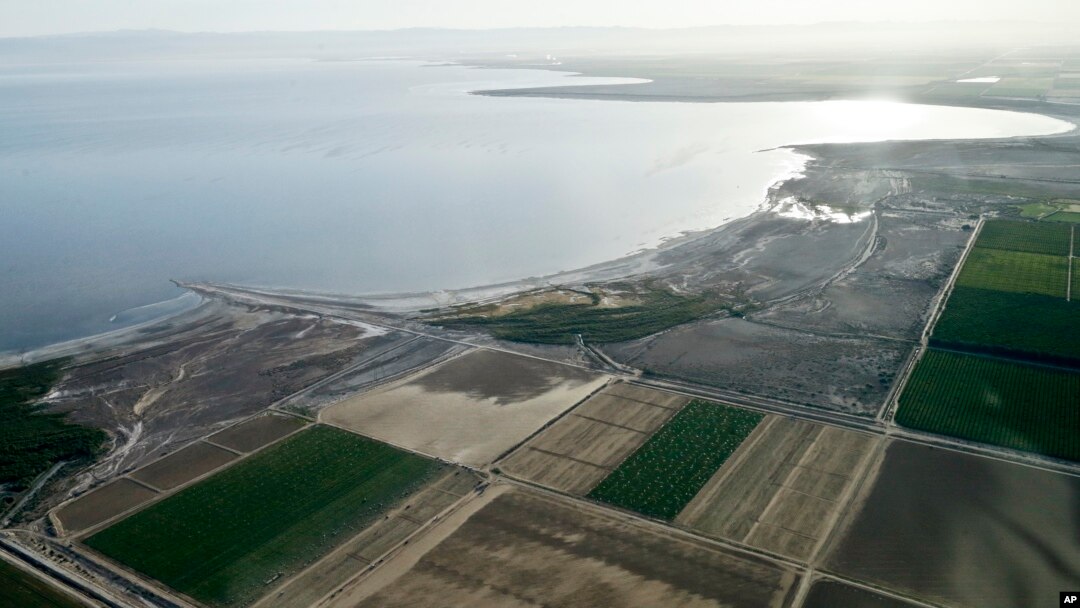 In this May 1, 2015, aerial photo, exposed lake bed of the Salton Sea dries out near Niland, California.