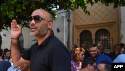 FILE—President of the Tunisian journalists' union Zied Dabbar addresses colleagues during a protest in front of the Tunis court where their colleagues Borhen Bssaies and Mourad Zeghidi are set to appear in court on May 22, 2024.