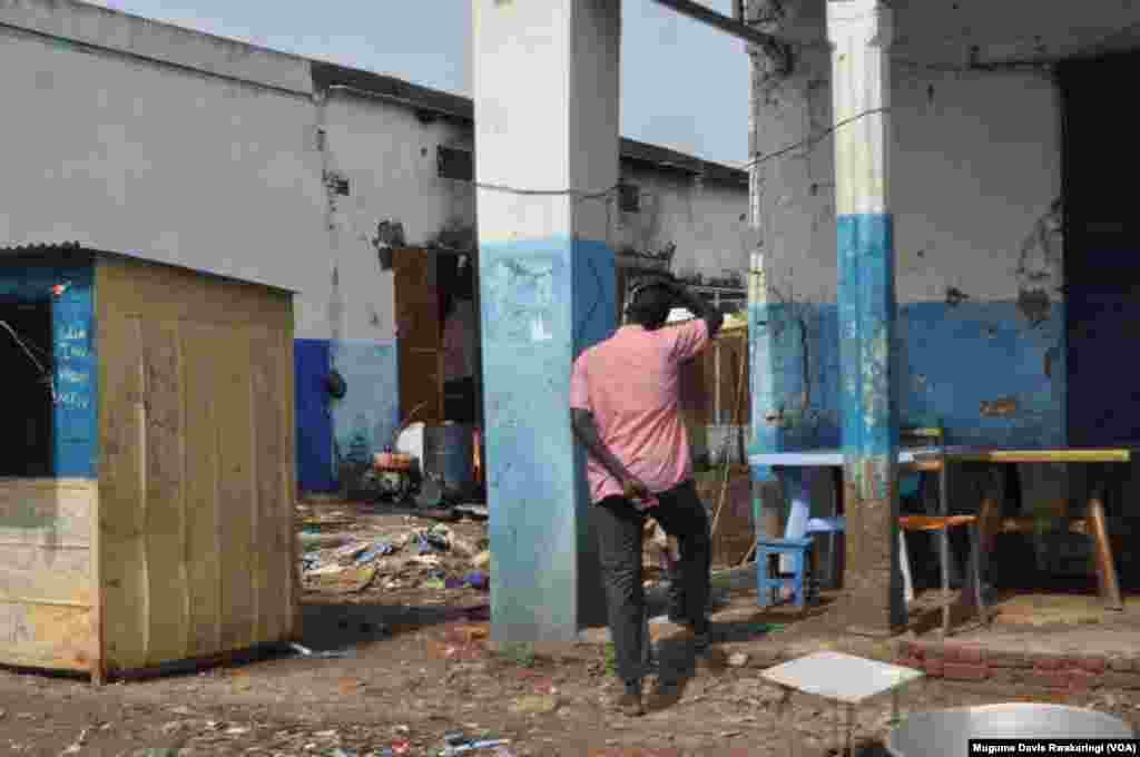 A man looks at what remains of a house in Malakal, South Sudan.