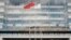 FILE - A Chinese flag flutters at the headquarters of China Development Bank in Beijing, Sept. 23, 2018.