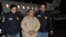 FILE - Mexico's top drug lord Joaquin "El Chapo" Guzman is escorted as he arrives at Long Island MacArthur airport in New York, Jan. 19, 2017, following his extradition from Mexico.