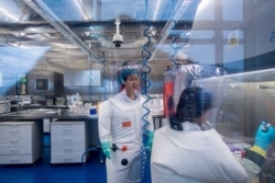 Chinese virologist Shi Zhengli (L) is seen inside the P4 laboratory in Wuhan, capital of China's Hubei province, Feb. 23, 2017.