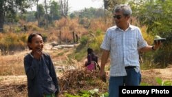 Im Chaem, a former Khmer Rouge regional commander, in a picture with Youk Chhang, executive director of the Documentation Center of Cambodia, in Anlong Veng, February 13, 2012. (Courtesy of Documentation of Cambodia) 