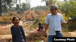 Im Chaem, a former Khmer Rouge regional commander, in a picture with Youk Chhang, executive director of the Documentation Center of Cambodia, in Anlong Veng, Cambodia, February 13, 2012. (Courtesy of Documentation of Cambodia)