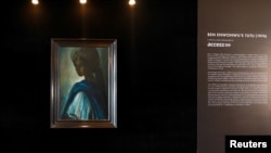 The painting entitled "Tutu," an artwork by late Nigerian artist Ben Enwonwu, is pictured at the Art X Lagos fair, in this handout picture obtained by Reuters, Nov. 5, 2018. 
