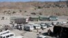 Shops, front right, and vehicles are seen at Ghulam Khan border checkpoint in Pakistan Tuesday, Jan. 7, 2003. More than a week after a disagreement with the United States over American military "hot pursuit" reaching over Afghanistan's edge, this remote c