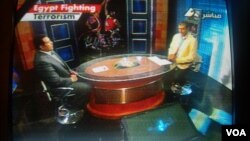 Egyptian television displays the "Egypt Fighting Terrorism" banner during a sports program, August 20, 2013. 