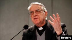 FILE - Vatican spokesman Father Federico Lombardi talks to reporters during a news conference at the Vatican. 