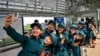 Soldiers take a selfie on the platform at a metro station in Ho Chi Minh City on Dec. 22, 2024.