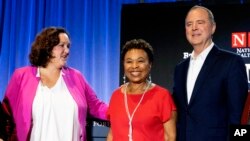 FILE —Rep. Adam Schiff, D-Calif., is joined by Rep. Katie Porter, D-Calif. left, and Rep. Barbara Lee D-Calif. center, pose for photos after a U.S. Senate Candidate Forum hosted by the National Union of Health Care Workers (NUHW) in Los Angeles on Sunday, Oct. 8, 2023.