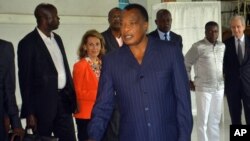 FILE - Congo incumbent President Denis Sassou N'Guesso casts his ballot, at a polling station, in Brazzaville, Congo, March 20, 2016. Tensions remain high in the country following N'Guesso's reelection.