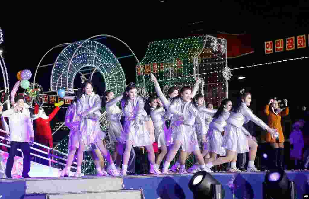 Dancers perform during celebrations to mark the New Year, at Kim Il Sung Square in Pyongyang, North Korea, Jan. 1, 2021.