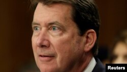 FILE - William Hagerty testifies in Washington before the Senate Foreign Relations Committee at a hearing on his nomination to become U.S. ambassador to Japan, May 18, 2017. The Senate confirmed his nomination July 13, 2017.
