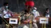 FILE - A voter casts her ballot in Ngozi, Burundi, May 20, 2020, amid concerns over political violence and COVID-19 infection.