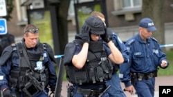 FILE - Police officers are seen in Tallinn, Estonia.