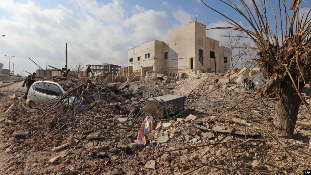 FILE - Destruction is seen around the Udai hospital following airstrikes on the town of Saraqeb in Syria's northwestern province of Idlib, Jan. 29, 2018. Syrian troops had been advancing on Idlib as part of a fierce offensive launched in late December with Russian backing.