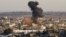 Smoke rises following an Israeli attack on Gaza City, Thursday, Nov. 15, 2012.