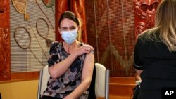 New Zealand Prime Minister Jacinda Ardern receives the first Pfizer COVID-19 vaccine at the Manurewa Vaccination center in Auckland, New Zealand, June 18, 2021. 