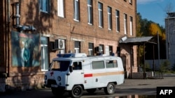 An ambulance moves past a hospital building in the town of Shelekhov in the Irkutsk region on October 7, 2026.