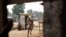 A woman runs for cover as heavy gunfire erupts in the Miskin district of Bangui, Central African Republic. In what a French soldier on the scene described as the heaviest exchange of fire he'd seen since early December 2013, Muslim militias engaged Burundi troops who returned fire. 