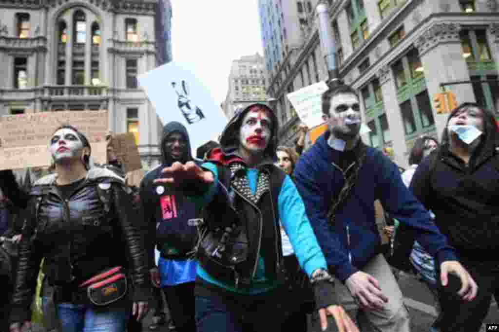 Protesters from Occupy Wall Street march down Broadway dressed as corporate zombies Monday, Oct. 3, 2011, in New York. The protests have gathered momentum and gained participants in recent days as news of mass arrests and a coordinated media campaign by t