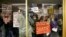 Protesters gather outside a press conference room during a special session at the North Carolina Legislature in Raleigh, N.C., Dec. 15, 2016. Republicans called their own special session to weigh legislation, some of which threatens the incoming Democratic governor. 